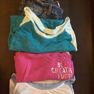 A pair a pants and 3 shirts.